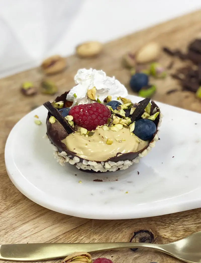 chocolate bowls with rich pistachio mousse and white cream 6