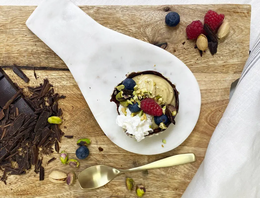 chocolate bowls with rich pistachio mousse and white cream 7